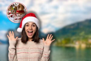 lago d'iseo sullo sfondo, donna sorpresa con cappello di babbo natale e mercatini di natale in icona