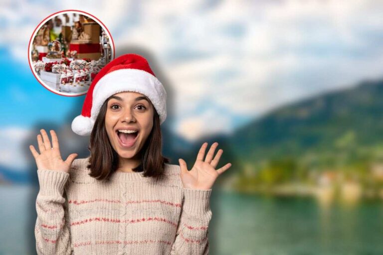 lago d'iseo sullo sfondo, donna sorpresa con cappello di babbo natale e mercatini di natale in icona